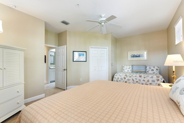 bedroom with visible vents, baseboards, carpet flooring, a closet, and a ceiling fan