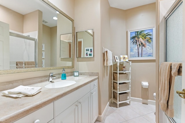 full bath featuring tile patterned flooring, visible vents, toilet, a shower with shower door, and vanity