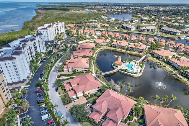 drone / aerial view with a residential view and a water view