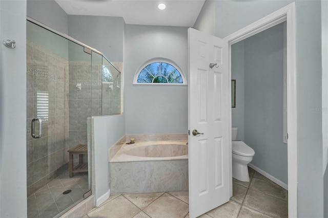 bathroom featuring a garden tub, a shower stall, and toilet