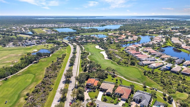 aerial view featuring a residential view, a water view, and golf course view