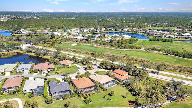 bird's eye view with golf course view, a water view, and a residential view