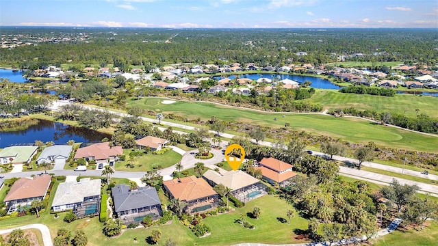 aerial view with view of golf course, a water view, and a residential view