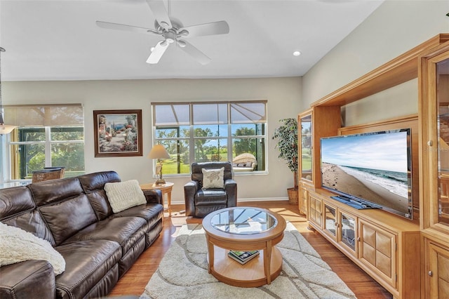 living room with a ceiling fan, recessed lighting, baseboards, and wood finished floors