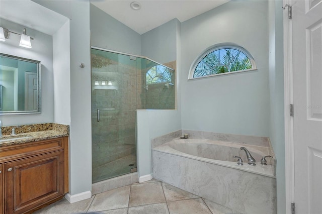 full bathroom with tile patterned flooring, a shower stall, a bath, and vanity