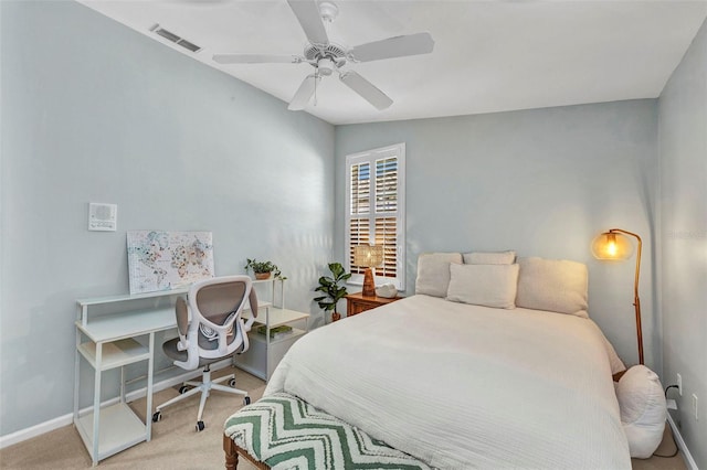 bedroom with light carpet, ceiling fan, visible vents, and baseboards