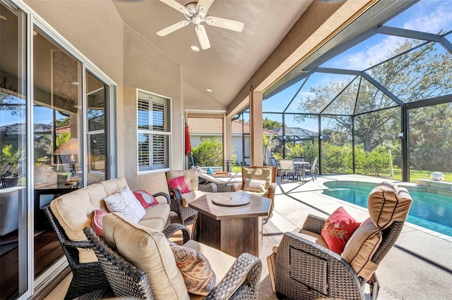 view of patio / terrace featuring an outdoor pool, glass enclosure, ceiling fan, and outdoor lounge area