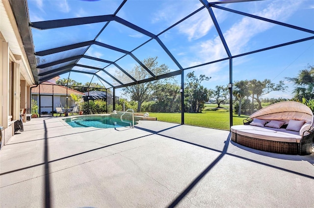 pool featuring glass enclosure, a patio area, and a lawn