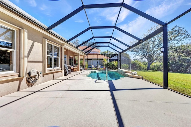 pool featuring a lawn, a patio area, and a lanai