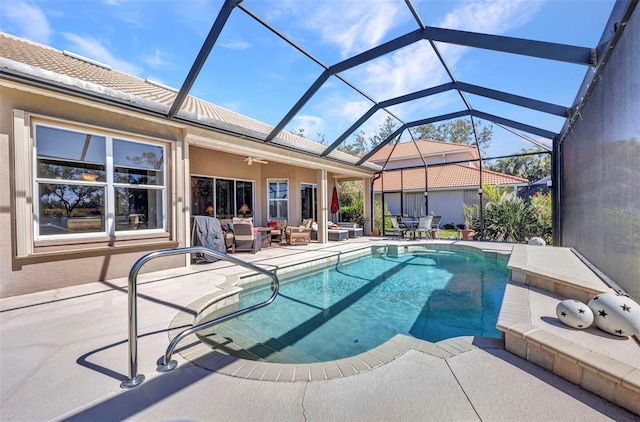 pool featuring a patio area, ceiling fan, and an outdoor hangout area