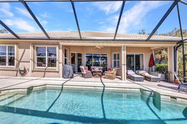 back of property featuring a patio area, outdoor lounge area, ceiling fan, and stucco siding