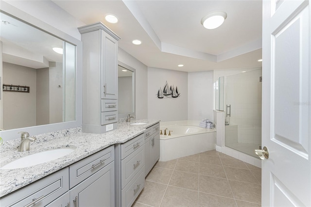 full bathroom with tile patterned flooring, a shower stall, double vanity, a bath, and a sink