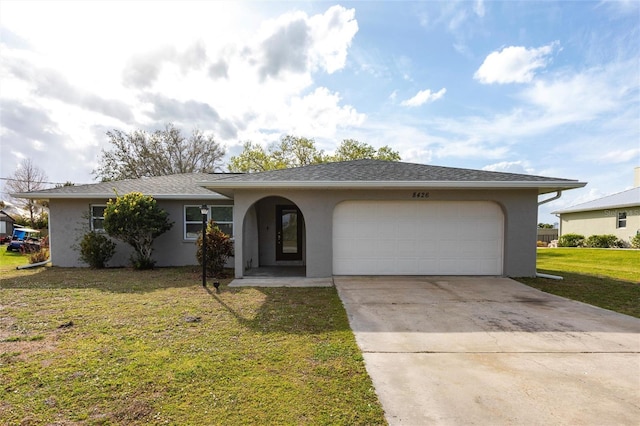 single story home with stucco siding, a shingled roof, an attached garage, driveway, and a front lawn