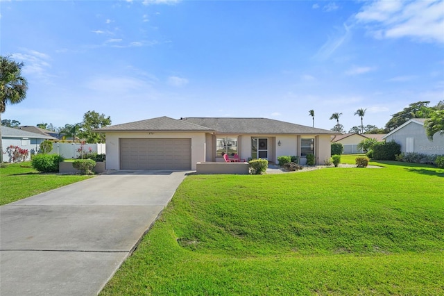 single story home with a garage, fence, concrete driveway, stucco siding, and a front lawn