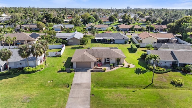 birds eye view of property with a residential view