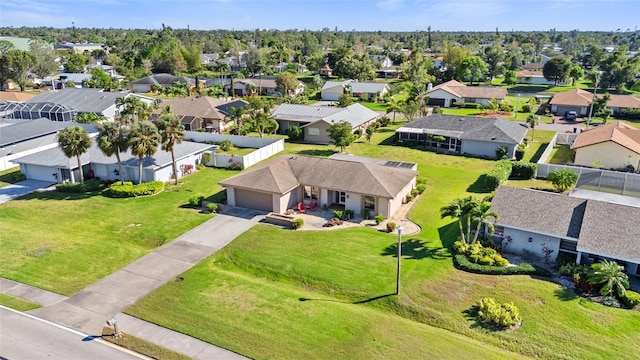 birds eye view of property with a residential view