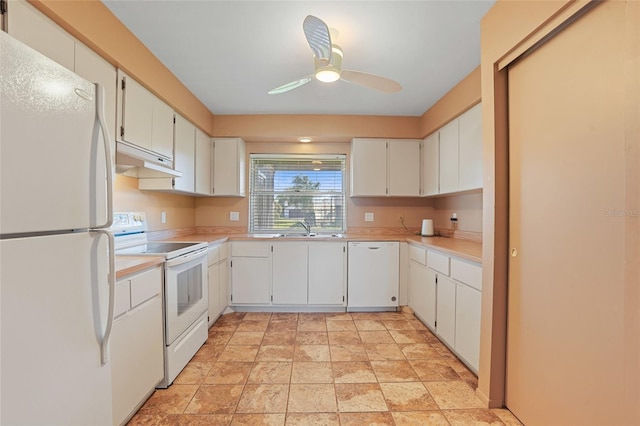 kitchen featuring under cabinet range hood, white appliances, a sink, a ceiling fan, and light countertops