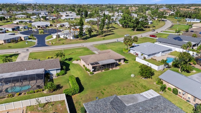 birds eye view of property with a residential view