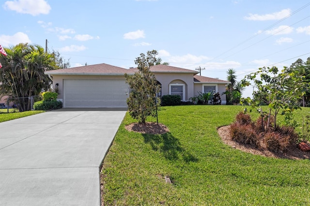 view of front of home featuring driveway, a front lawn, an attached garage, and stucco siding