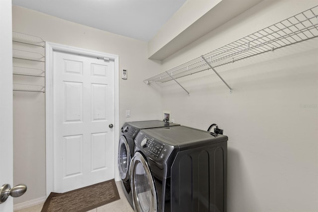 washroom with laundry area and washing machine and dryer