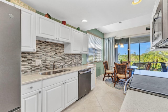 kitchen featuring a sink, white cabinetry, appliances with stainless steel finishes, and light countertops