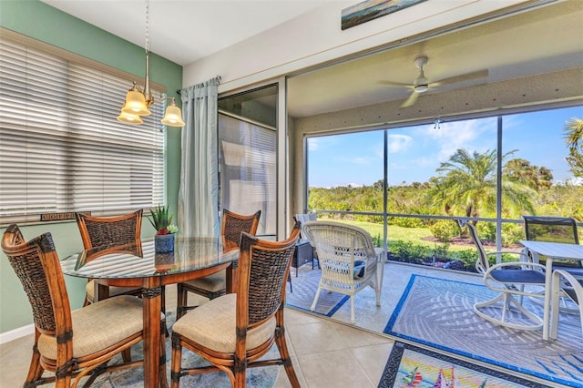 sunroom featuring ceiling fan