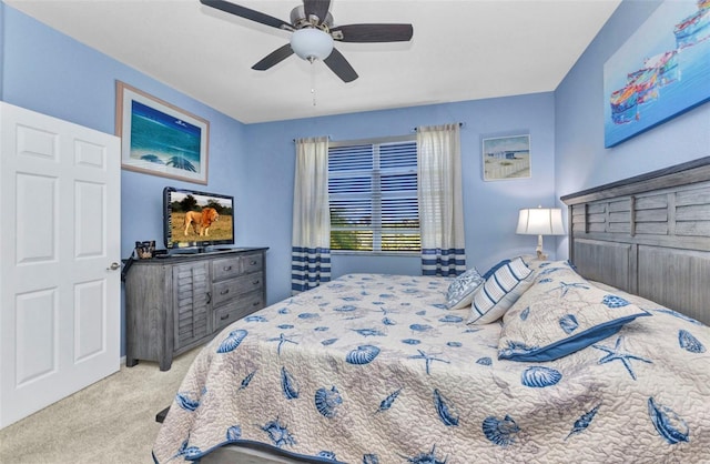 carpeted bedroom with a ceiling fan