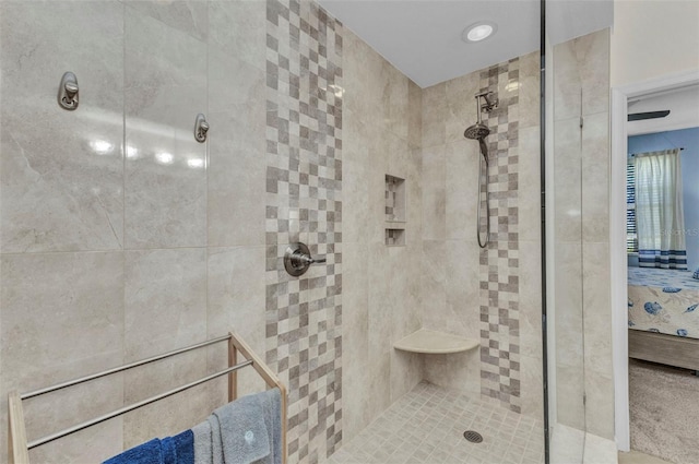 bathroom with tiled shower