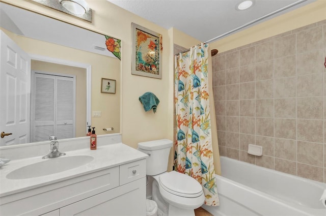 full bath with vanity, toilet, and shower / bath combo with shower curtain