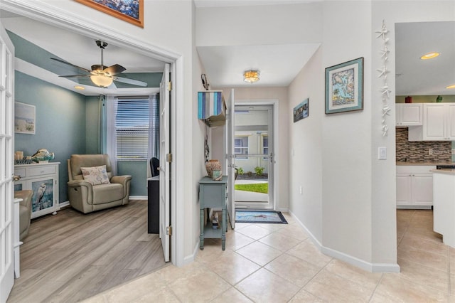 entrance foyer with light tile patterned floors, recessed lighting, baseboards, and ceiling fan