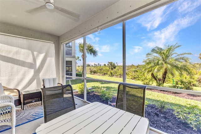 sunroom with a ceiling fan