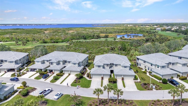 aerial view with a residential view and a water view