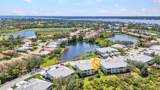 bird's eye view with a residential view and a water view