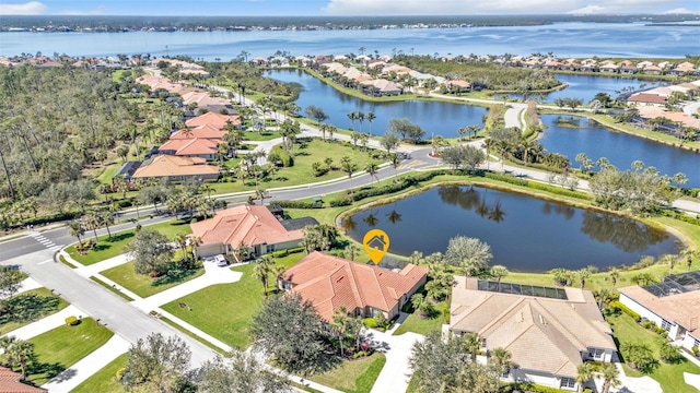 birds eye view of property featuring a residential view and a water view