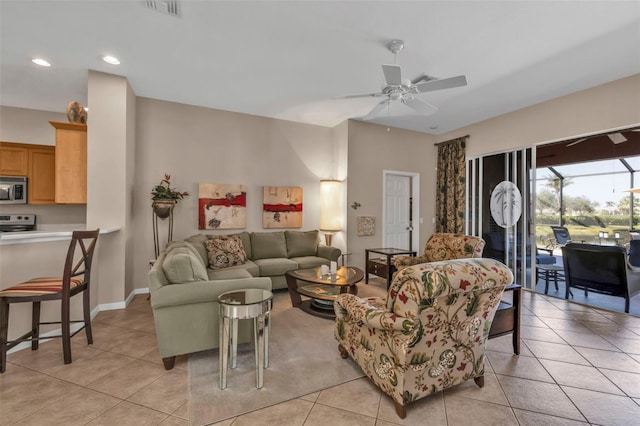 living area with visible vents, ceiling fan, recessed lighting, a sunroom, and light tile patterned flooring