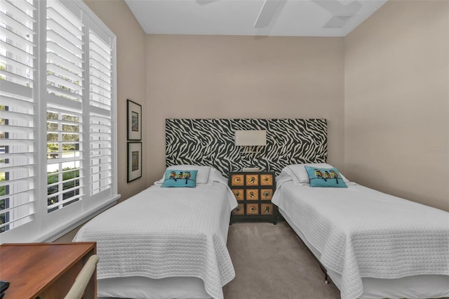 carpeted bedroom with a ceiling fan