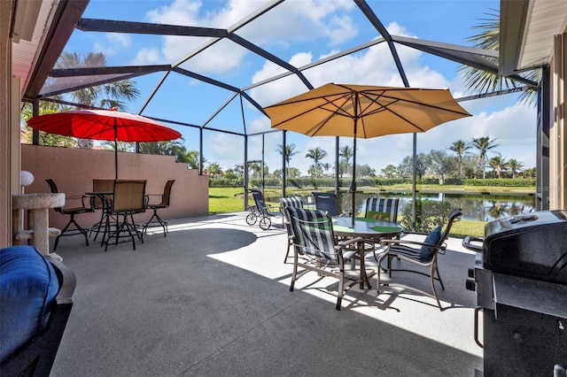 view of patio with outdoor dining space, a lanai, and a water view