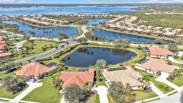 birds eye view of property featuring a residential view and a water view