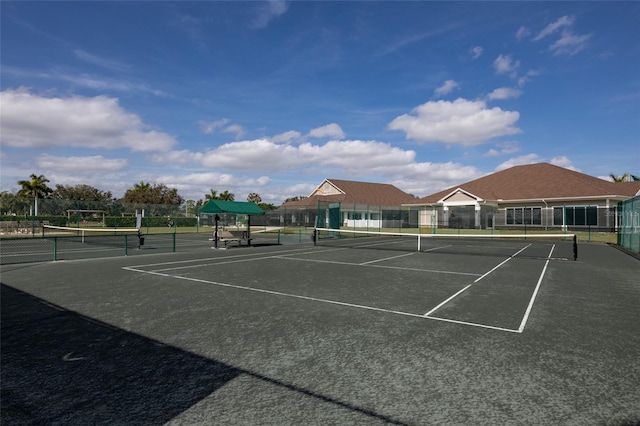 view of tennis court with fence