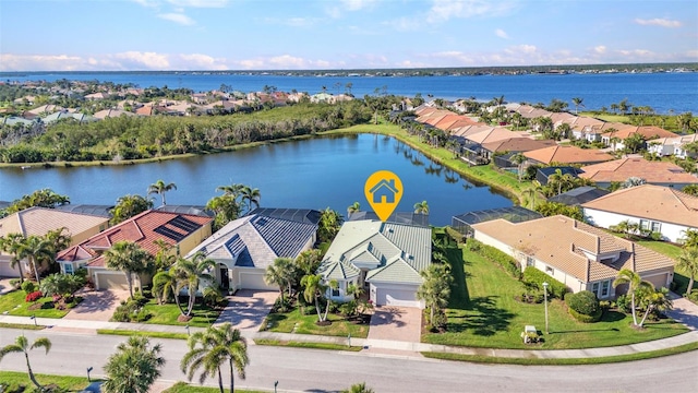 birds eye view of property featuring a residential view and a water view