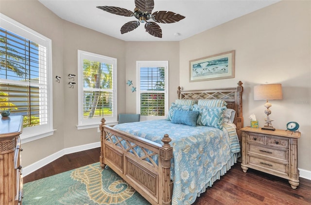 bedroom featuring dark wood finished floors, baseboards, and ceiling fan