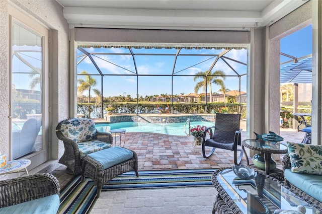 view of patio / terrace featuring glass enclosure and an outdoor pool