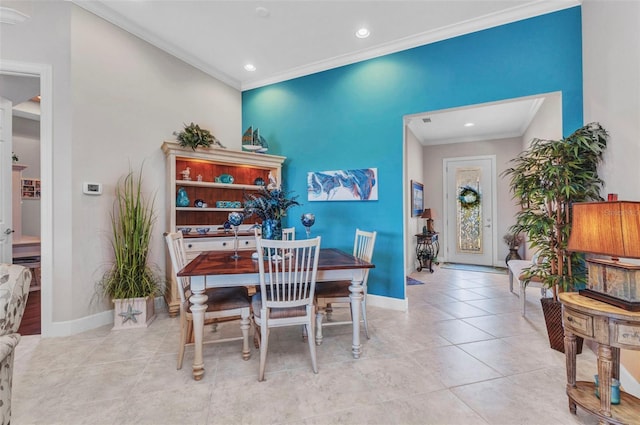 dining room featuring light tile patterned floors, baseboards, ornamental molding, and recessed lighting