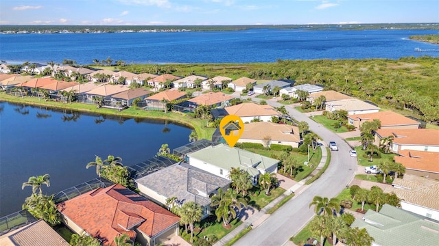 aerial view with a residential view and a water view