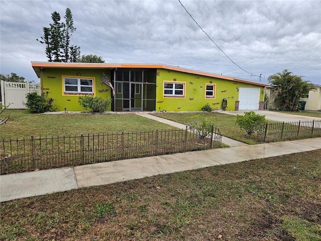 view of front of house featuring a fenced front yard, stucco siding, concrete driveway, a front yard, and a garage