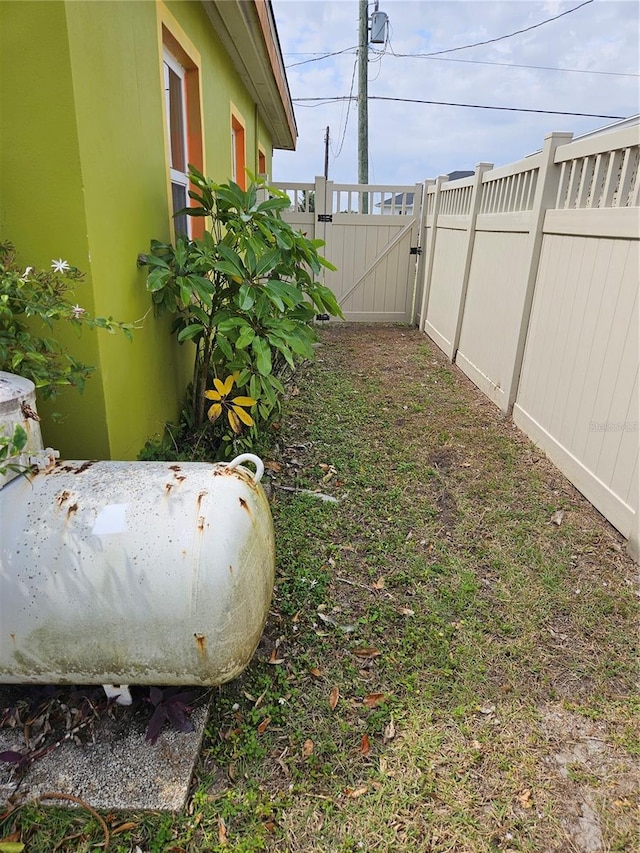 view of yard featuring a gate and fence