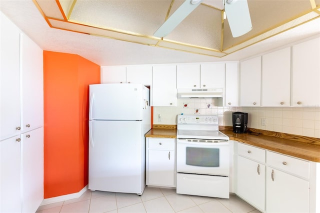 kitchen featuring white appliances, tasteful backsplash, under cabinet range hood, and white cabinets