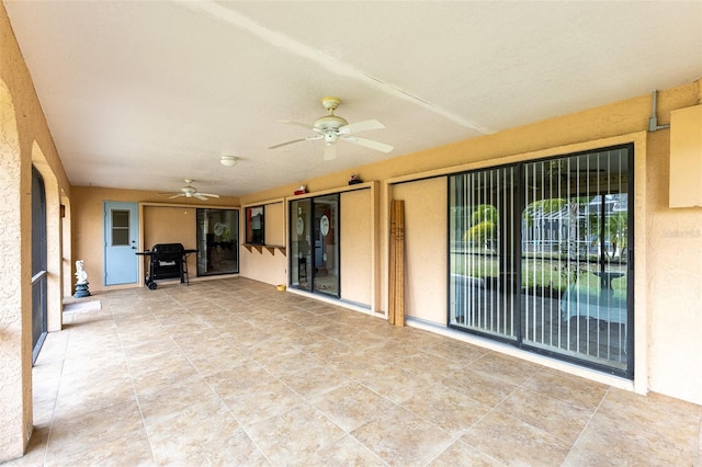 view of patio / terrace featuring ceiling fan