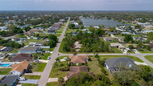 aerial view with a water view and a residential view