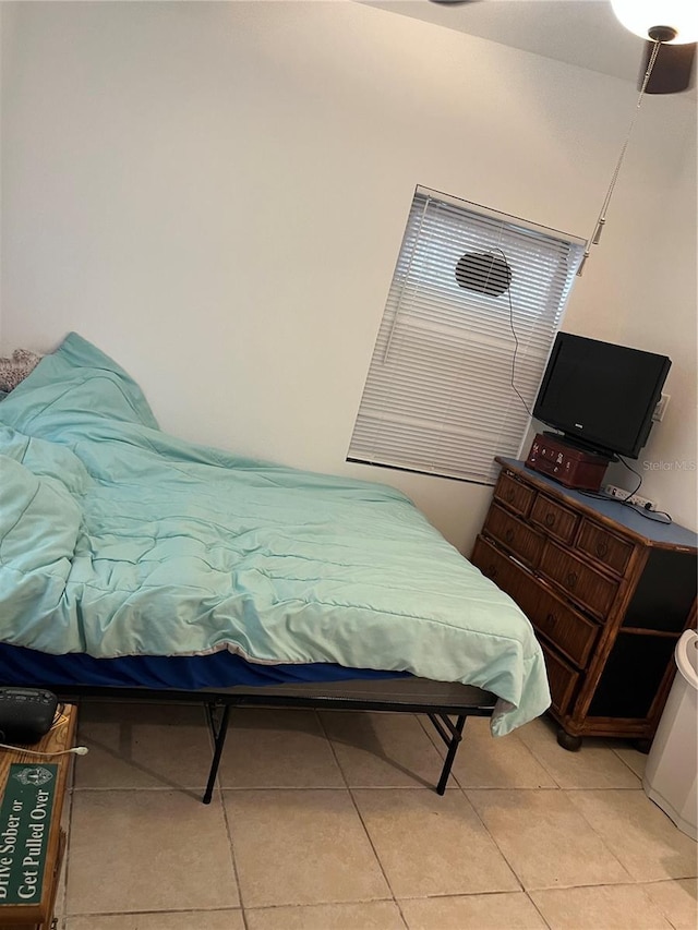bedroom with light tile patterned flooring